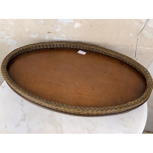 186 - A WICKER OVAL WOVEN EDGED TRAY 25 x 16”