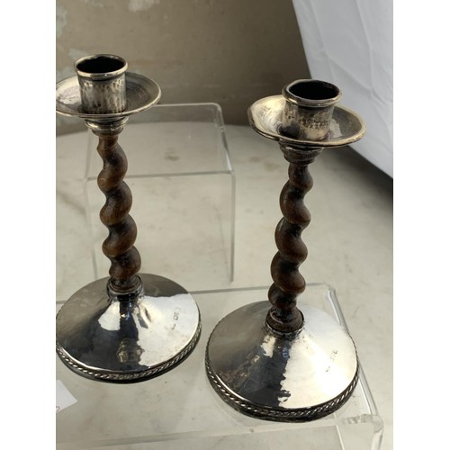 210 - A PAIR OF CHESTER SILVER MOUNTED CANDLE STICKS WITH AN ANTIQUE WOODEN TWIST STEM