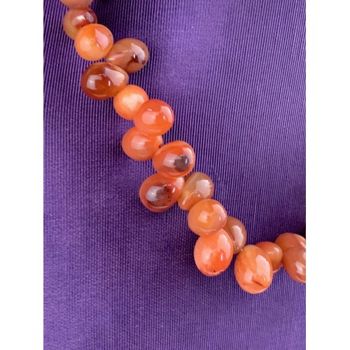 213 - A VINTAGE CORNELIAN STONE SET NECKLACE