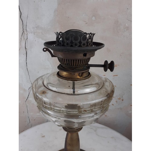 306 - A BRASS PILLAR OIL LAMP 18