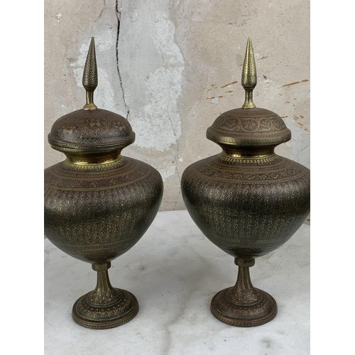 317 - A PAIR OF INDIAN BRASS URNS AND LIDS 13