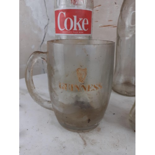 320 - A GUINESS TANKARD AND 3 COLLECTABLE COKE BOTTLES