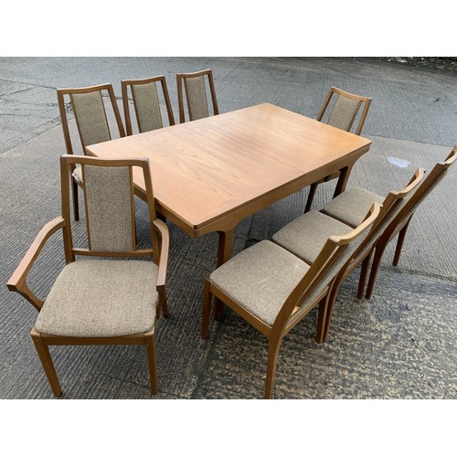 397 - A NATHAN EXTENDING DINNG TABLE AND 8 CHAIRS