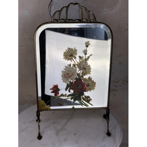 398 - AN ANTIQUE BRASS MIRRORED HAND PAINTED FIRESCREEN