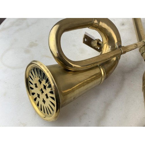 438 - A PAIR OF WALL MOUNTED BRASS BUGLE 13