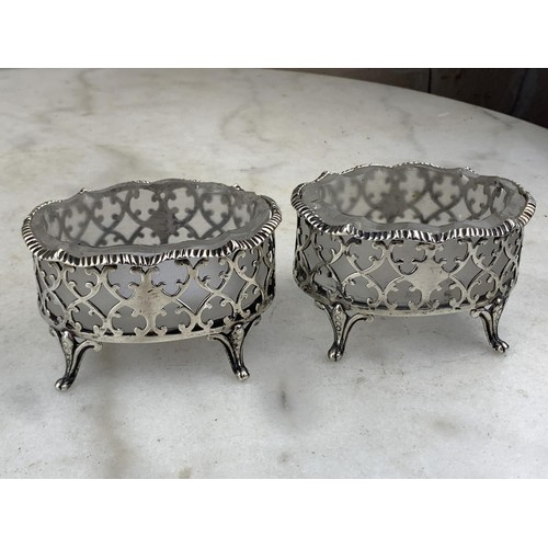 591 - A PAIR OF LARGE ORNATE LONDON (1874) SILVER SALT STANDS WITH ANTIQUE FROSTED GLASS LINERS (SILVER WE... 