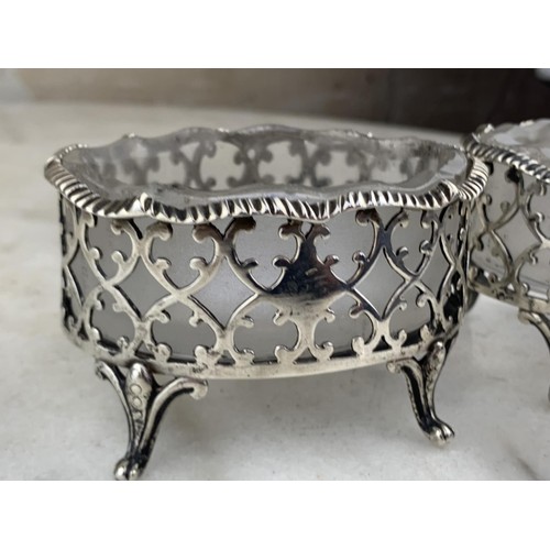 591 - A PAIR OF LARGE ORNATE LONDON (1874) SILVER SALT STANDS WITH ANTIQUE FROSTED GLASS LINERS (SILVER WE... 