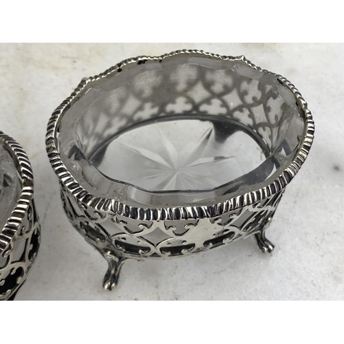 591 - A PAIR OF LARGE ORNATE LONDON (1874) SILVER SALT STANDS WITH ANTIQUE FROSTED GLASS LINERS (SILVER WE... 