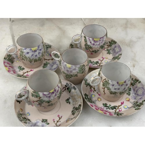 534 - A SET OF 10 ORIENTAL EGGSHELL CUPS WITH 4 SAUCERS