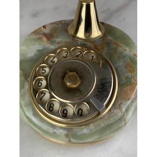 702 - AN ONYX AND BRASS FINISHED TELEPHONE