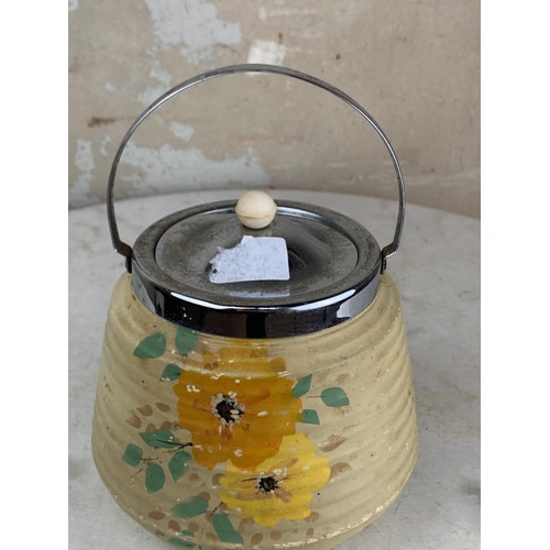 72 - A HANDPAINTED BISCUIT BARRELL WITH EP TOP