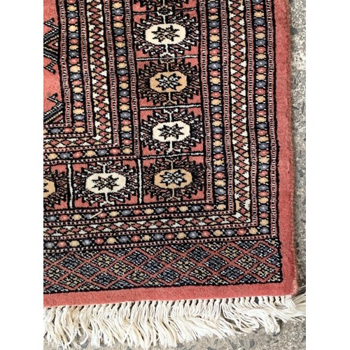 776 - A HAND STICTHED BURNT ORANGE STYLE PAKISTANI WOOLEN RUG 56 x 38