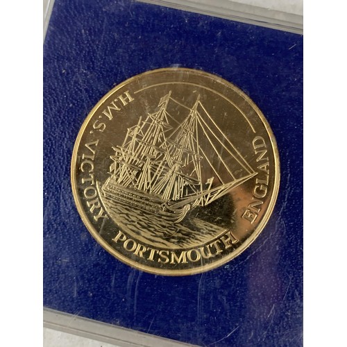 215 - A 22ct GOLD PLATED ADMIRAL LORD NELSON H.M.S VICTORY COIN