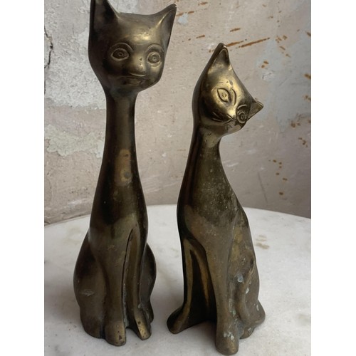 110A - A PAIR OF HEAVY BRASS CATS