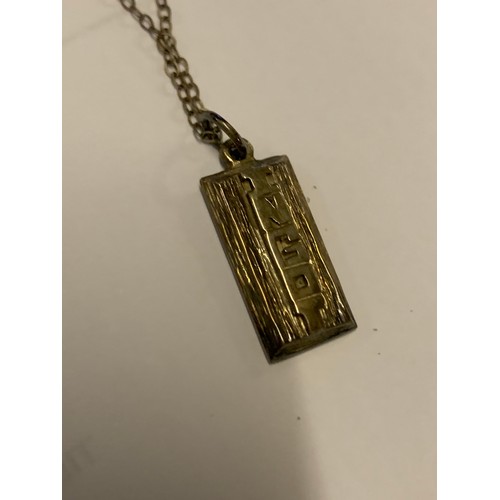 279 - A SILVER INGOT ON A SILVER CHAIN