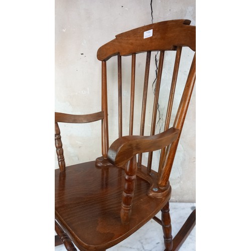 7 - AN EARLY 20th CENTURY CHILDS ROCKING CHAIR