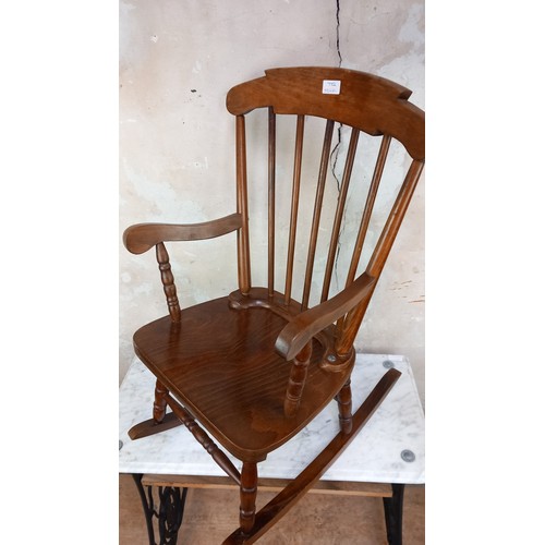 7 - AN EARLY 20th CENTURY CHILDS ROCKING CHAIR