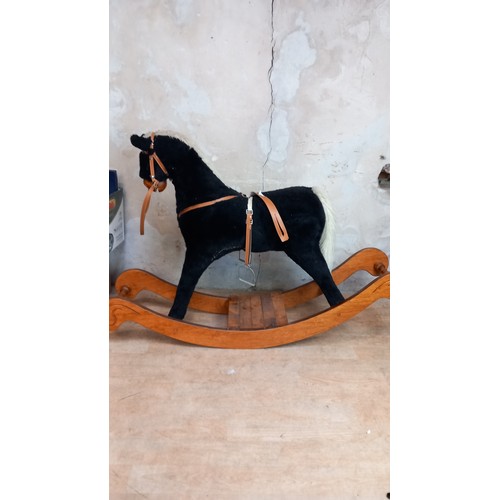 12 - A CHILDS LARGE ROCKING HORSE