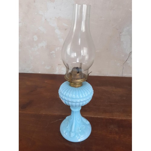 39 - A VINTAGE BLUE GLASS OIL LAMP WITH FUNNELL