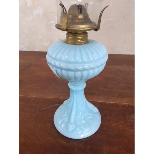 39 - A VINTAGE BLUE GLASS OIL LAMP WITH FUNNELL