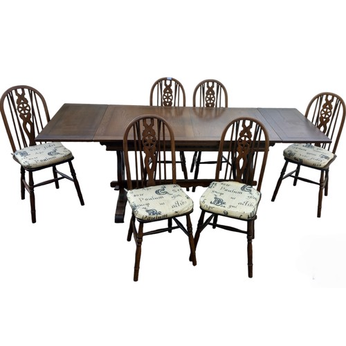 11 - A DRAW LEAF OAK TABLE 2 CARVERS AND 4 CHAIRS