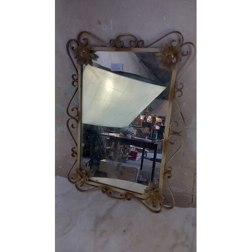 43 - A VINTAGE METAL FRAAMED MIRROR