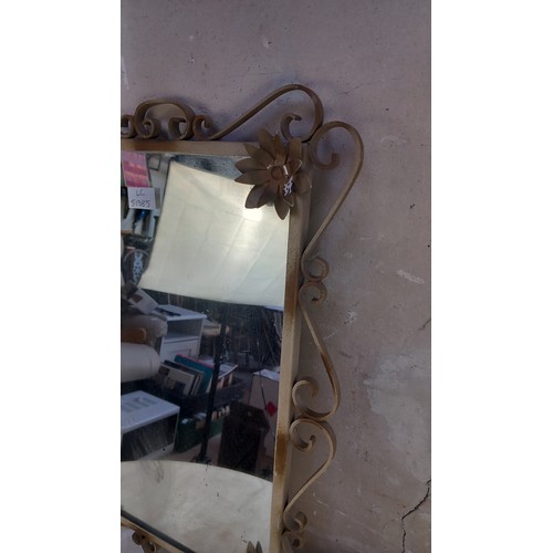 43 - A VINTAGE METAL FRAAMED MIRROR