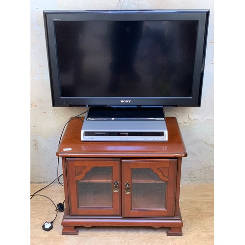 57 - A SONY BARVIA T.V, DVD PLAYER/RECORDER ON A YEWWOOD TV UNIT