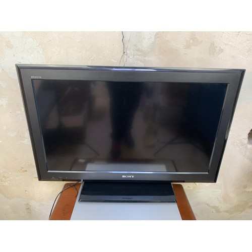 57 - A SONY BARVIA T.V, DVD PLAYER/RECORDER ON A YEWWOOD TV UNIT