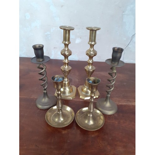 82 - 3 SETS OF BRASS CANDLESTICKS