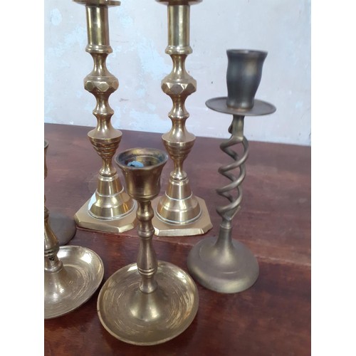 82 - 3 SETS OF BRASS CANDLESTICKS