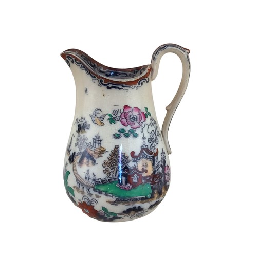 94 - AN ANTIQUE IRONSTONE JUG 6.5