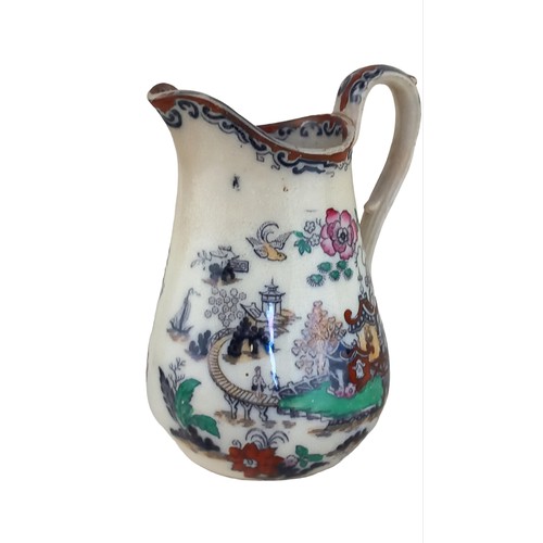 94 - AN ANTIQUE IRONSTONE JUG 6.5