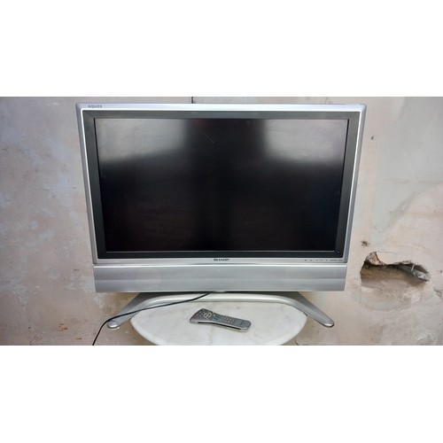 142 - SHARP TV WITH REMOTE