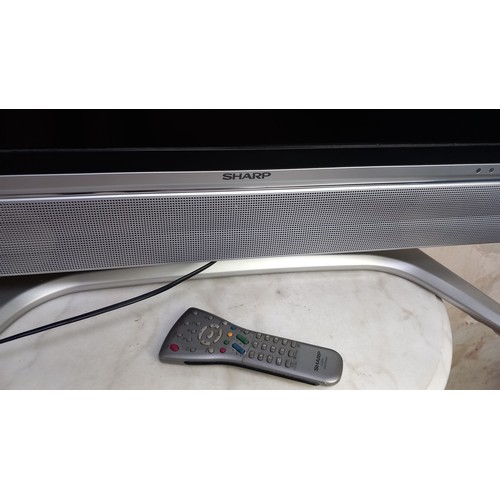 142 - SHARP TV WITH REMOTE