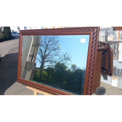 143 - A MAHOGANY ROPE FRAMED  BEVELLED MIRROR