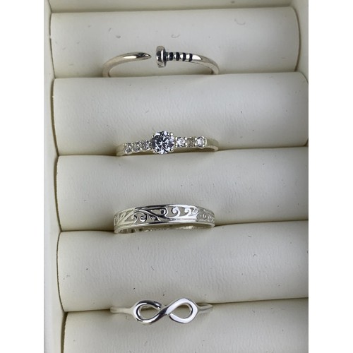 253 - 4 MIXED SILVER RINGS AND JEWELLERY BOX