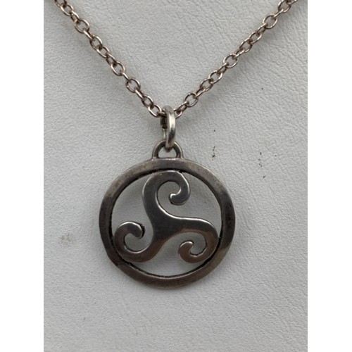 263 - SILVER CELTIC DESIGN PENDANT ON A SILVER CHAIN SET WITH STARS