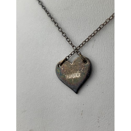 276 - A VINTAGE HEART SHAPED PENDANT ON SILVER CHAIN