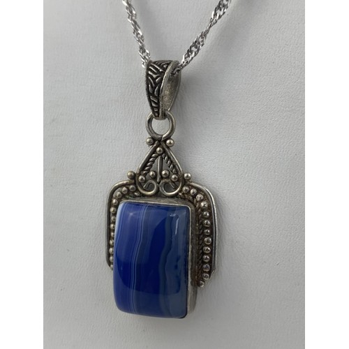 295 - A LAPIS SILVER PENDANT ON SILVER CHAIN