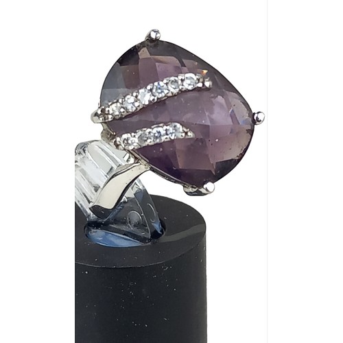 248 - A SILVER DESIGNER PURPLE STONE RING SET WITH GEM STONES