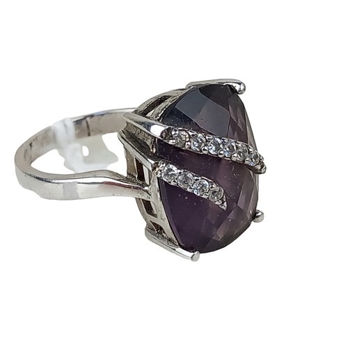 248 - A SILVER DESIGNER PURPLE STONE RING SET WITH GEM STONES