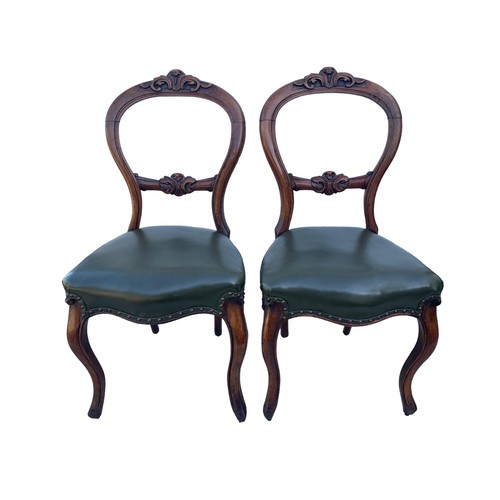 386 - A PAIR OF VICTORIAN WALNUT SIDECHAIRS WITH GREEN LEATHER SEATS