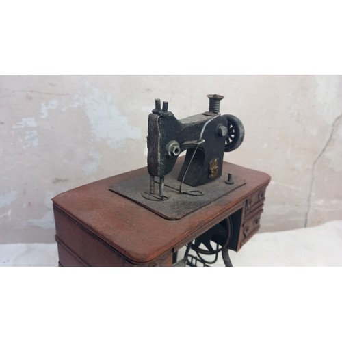 404 - A MINITURE TABLE SEWING MACHINE (ORNAMENTAL)