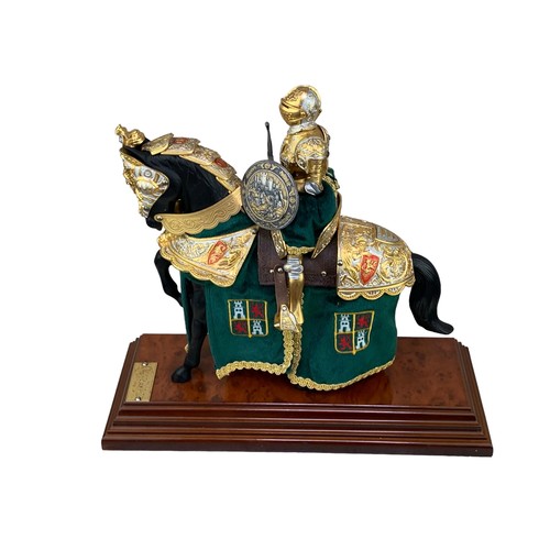 378 - A VERY DECORATIVE KNIGHT ON HORSEBACK BY MARTO ON A BIRDS EYE WALNUT BASE APPROX 13