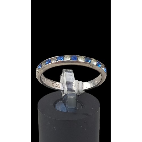 572 - A SILVER ETETRNITY RING SET WITH BLUE & WHITE STONES