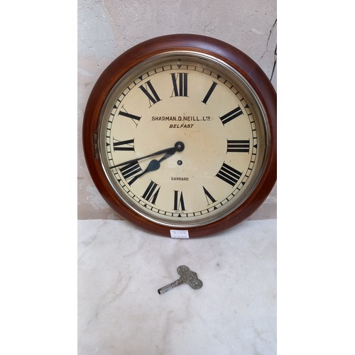 724 - A SCHOOL CLOCK WITH KEY (SHARMAN D NEILL LTD BELFAST)