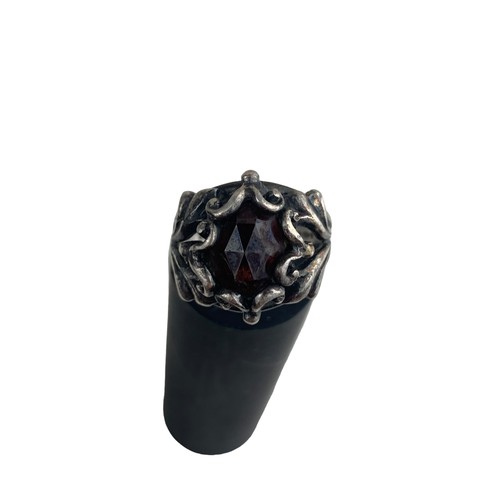 260 - ORNATE SILVER RING WITH GARNET STONE