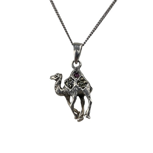 278 - A SILVER MARACITE CAMEL PENDANT SET WITH A PINK STONE ON A SILVER CHAIN