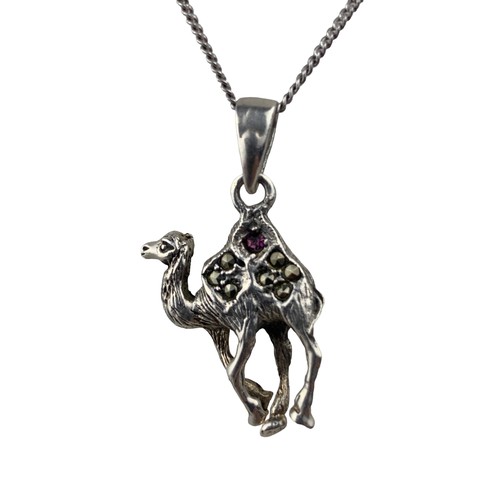 278 - A SILVER MARACITE CAMEL PENDANT SET WITH A PINK STONE ON A SILVER CHAIN